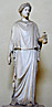 statue of woman wearing peplos